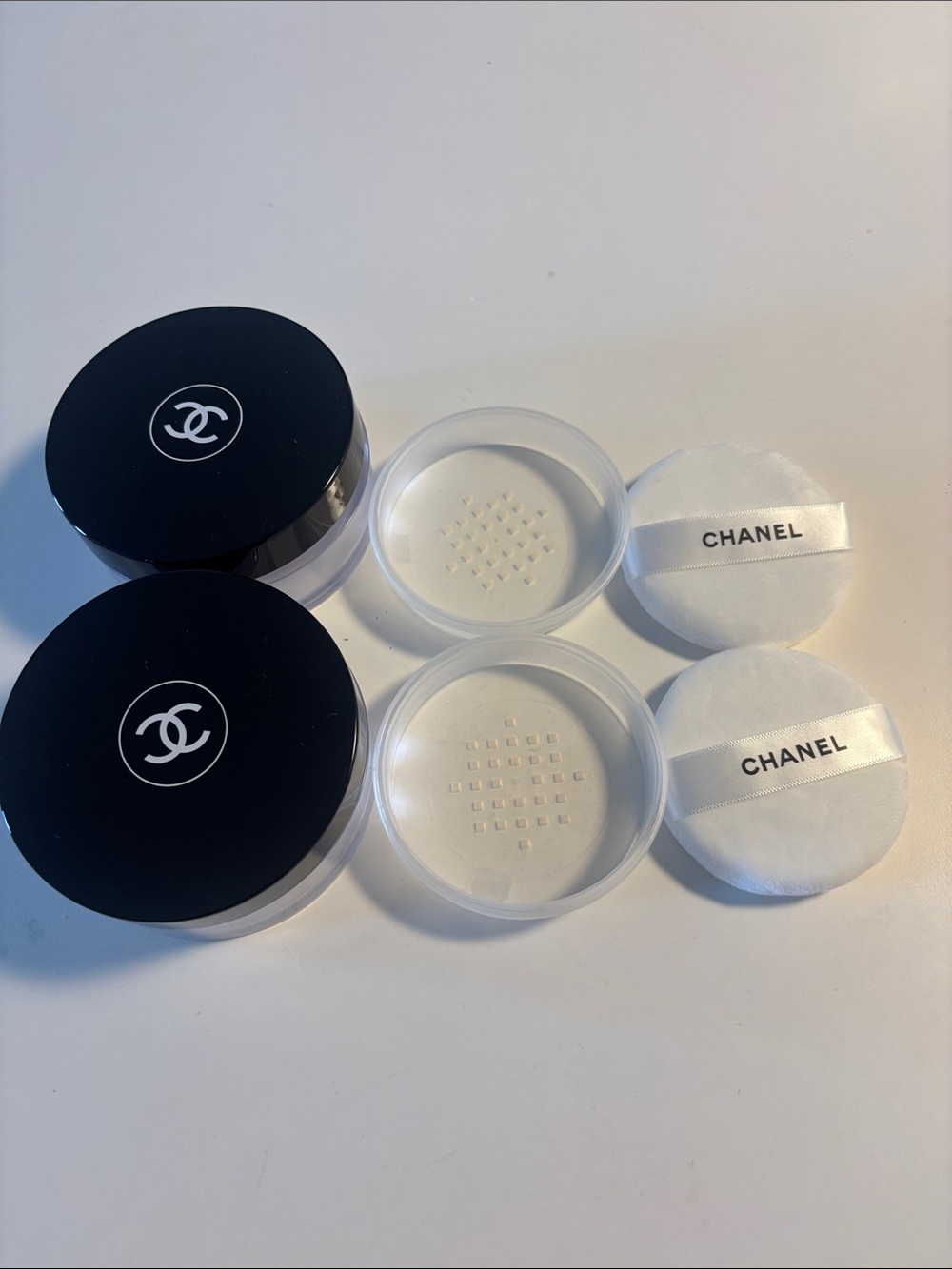 Chanel powder jars and puffs